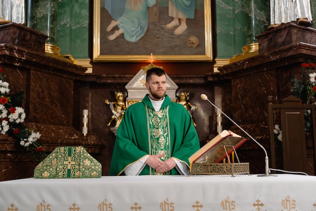 A Male Priest in Green Vestment